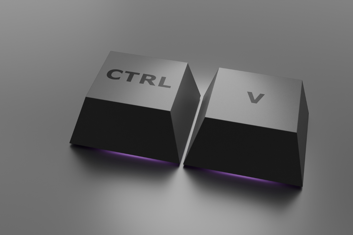 Teclas Ctrl e V destacadas lado a lado representando o atalho de colar no teclado de computador.